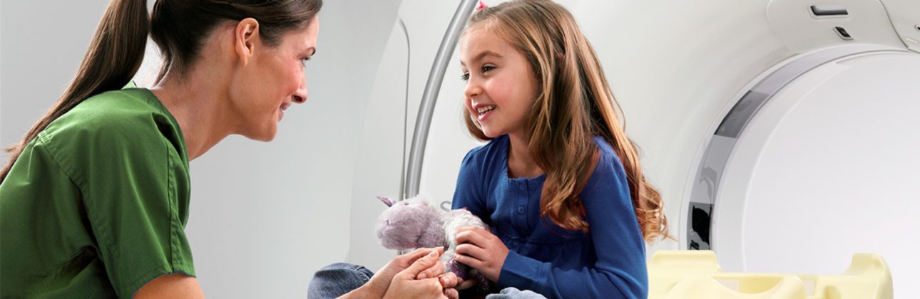 Nurse and patient in front of a MRI machine