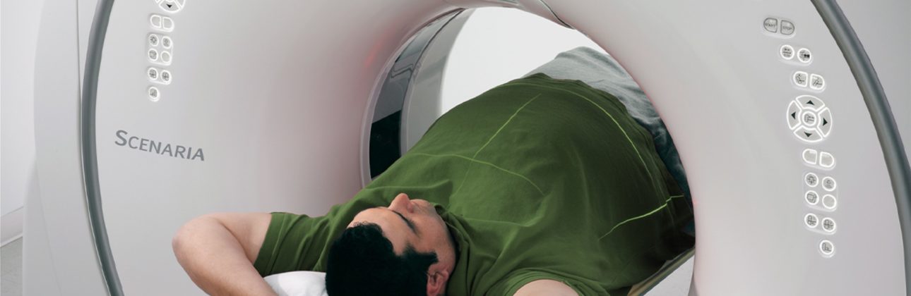 male patient laying inside a MRI machine