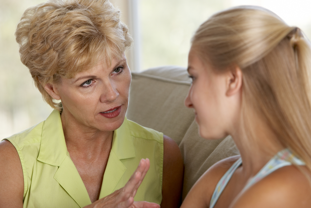 Woman Having A Serious Talk With Her Daughter about breast cancer risk
